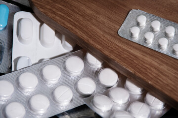 pills tablets on wooden background
