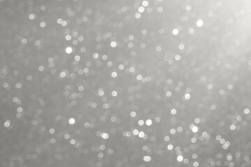 Soft gray bokeh backdrop with light orbs creating an elegant abstract sparkle scene Demonstration Color of the Year 2026