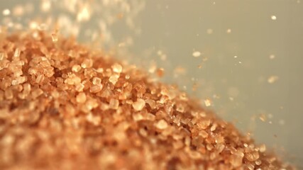 Cane sugar falls into a heap. Filmed on a high-speed camera at 1000 fps. High quality FullHD footage