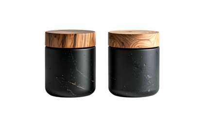Two cylindrical black containers with marble-like texture and wooden lids, set against a stark black background