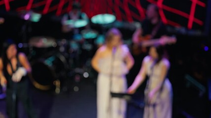 Vivid trio energizes stage, Unclear vocalists entertain with lively motions and spotlight effects