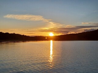 A beautiful golden sunset reflecting off of Canada Lake in the Adirondack Wilderness.