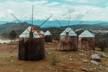 Old Mountain Windmills in Northern Portugal 
A group of traditional stone windmills standing on a mountain ridge in northern Portugal