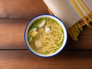 chicken broth soup, with noodles and egg, photo for restaurant menu
