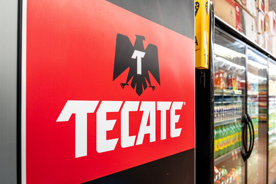 Tecate Beer logo on the side of a supermarket refrigerator. Heineken brand, originated in Tecate, B.C., Mexico. Guadalajara, Jalisco, December 4, 2025.