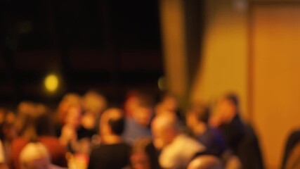 Engaged crowd during panel discussion, Panel event with attentive audience and guiding moderator present