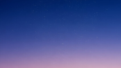 Fototapeta premium A gradient background transitioning from deep night blue to soft twilight purple, with tiny, subtle white stars