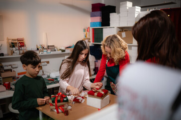 Family gift wrapping christmas holiday presents together