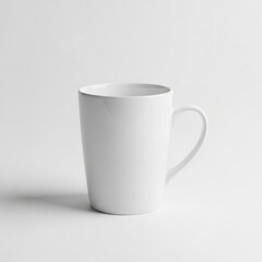 Obraz premium Simple white ceramic coffee mug standing on plain background