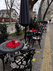 Elegant Outdoor Café Setting with Black Iron Furniture