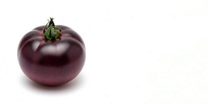 Purple tomato isolated on a clean white background with large copy space for your text, showcasing its vibrant color, fresh texture, and unique appearance for food, nutrition, and culinary concepts.