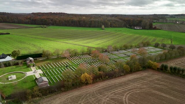 Aerial view of Hooge Crater Cemetery near former First World War battlefields, surrounded by fields and rural landscapes in Flanders.