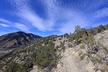 Hiking trail on Mount Medaris above town of New Castle, Colorado on sunny autumn afternoon.