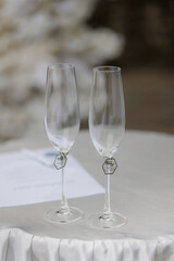 Elegant champagne glasses ready for celebration at a wedding reception outdoors