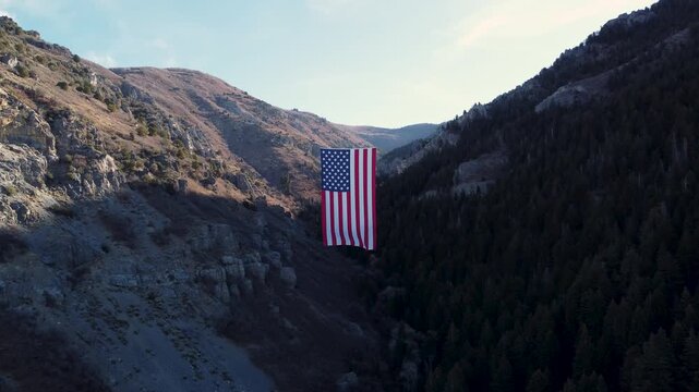 4K Aerial Views of The Major Large American Flag Hanging in Mountains of North Ogden Utah Veterans Day - Coldwater Creek Canyon 