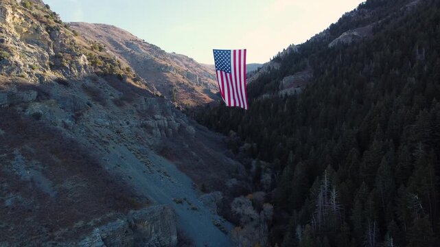 4K Aerial Views of The Major Large American Flag Hanging in Mountains of North Ogden Utah Veterans Day - Coldwater Creek Canyon 