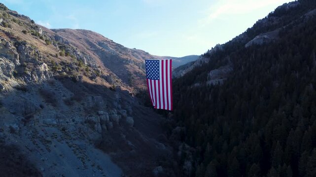 4K Aerial Views of The Major Large American Flag Hanging in Mountains of North Ogden Utah Veterans Day - Coldwater Creek Canyon 
