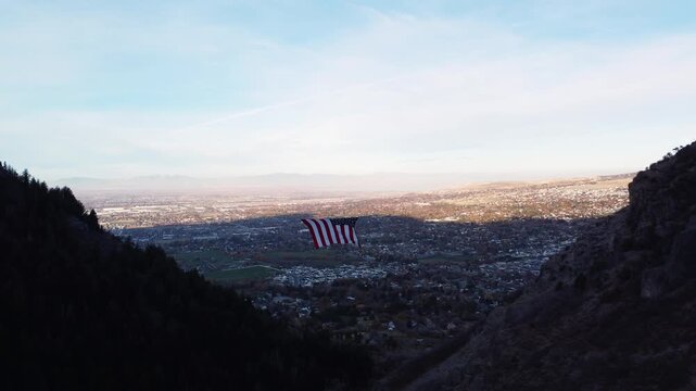 4K Aerial Views of The Major Large American Flag Hanging in Mountains of North Ogden Utah Veterans Day - Coldwater Creek Canyon 