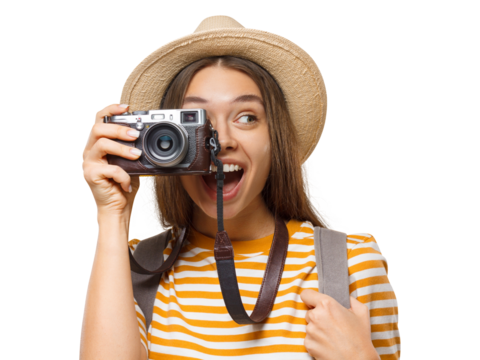 Excited young tourist taking a photo with a vintage camera, smiling with wow expression