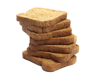 Pile sliced whole wheat dry integral bread with wholewheat flour isolated on white background, side view 