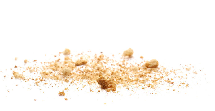 Crumbs  scattered, rusks with wholewheat flour isolated on white background and texture, side view