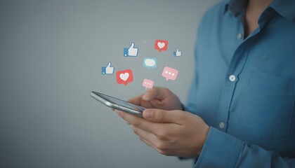 Person using a smartphone with social media icons like hearts and thumbs up floating concept for online engagement and communication
