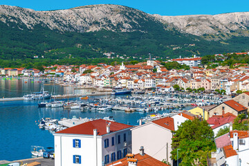 Scenic coastal town with marina and mountain view. Ba&scaron;ka, Krk island, Croatia