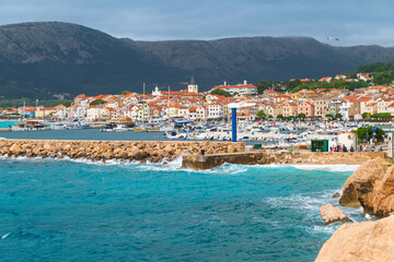 Scenic coastal town with vibrant skyline and mountain backdrop. Baška, Krk island, Croatia