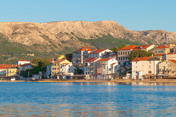 Charming coastal town with mediterranean architecture along serene waterfront. Ba&scaron;ka, Krk island, Croatia