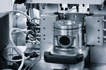 engine  piston with cone shaped top. auto service concept background.
