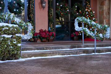 Festive holiday entrance decorated with garlands and wreaths, creating a warm and inviting atmosphere