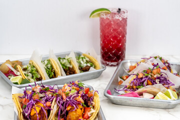 Family style feast of Latino cuisine with choices of carne asada, shrimp, or beer batter fish tacos and a Jamaican Margarita to wash it down