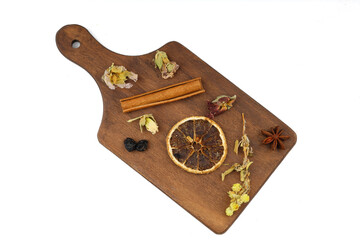 Winter tea for health in cold weather. Flavored with ginger, cinnamon, hibiscus, and orange. Isolated on white background