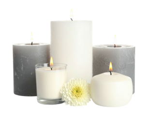 Various lit candles of different sizes and shapes, with a white flower, on a transparent background