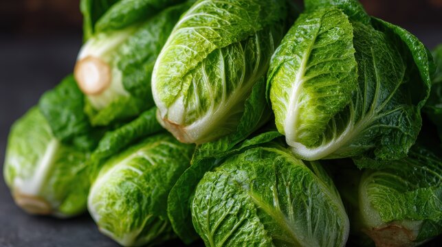 Fresh Little Gem Lettuces: Close-up of crisp, vibrant little gem lettuces, their fresh green leaves tightly packed, ready to be enjoyed as a culinary delight or a healthy ingredient.