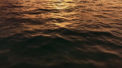 Sunset casts a warm glow on the surface, turning the water into a mesmerizing tapestry of golden hues. Calm and peaceful, it invites quiet reflection and appreciation of nature's artistry.