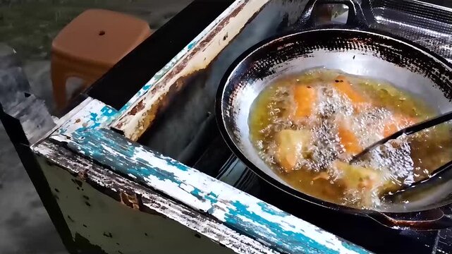street food with oily fried in pan