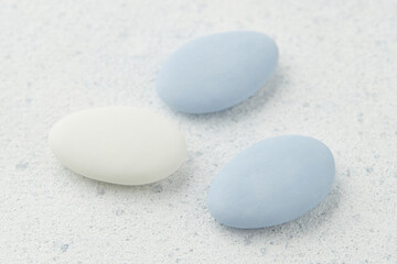 Traditional Easter Portuguese candies. White and blue sweets on grey background