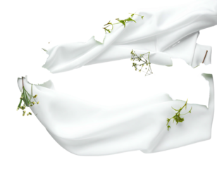 White fabric sections with greenery elements placed upon a black background
