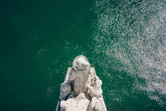 A captivating aerial view of the Monument to the Discoveries in Lisbon, Portugal, overlooking the Tejo River