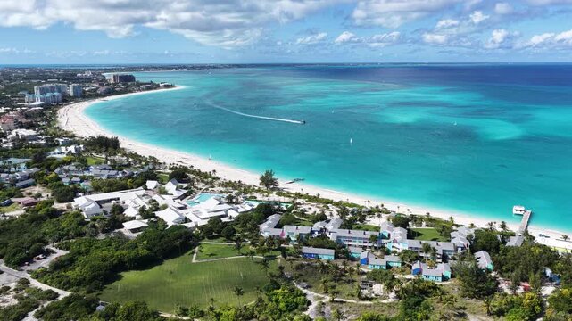 Grace Bay At Turks And Caicos In Overseas Territory United Kingdom. Caribbean Skyline. Beach Landscape. Highrise Buildings. Grace Bay In United Kingdom. Nature Background