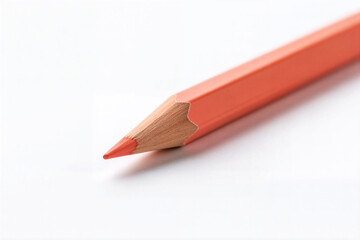 Sharpened orange pencil close-up, suited for writing, drawing and back-to-school themes.