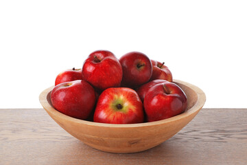 Ripe red apples in bowl on wooden table against white background, closeup