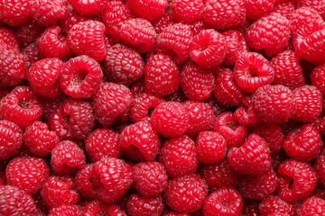 Fresh ripe raspberries as background, top view
