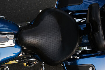 Closeup of a vintage motorcycle seat.