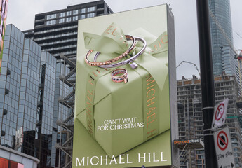 Fototapeta premium digital billboard with Michael Hill advertisement facing Sankofa Square, Toronto