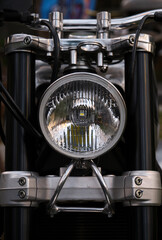 Close-up of the headlights of a vintage motorcycle.