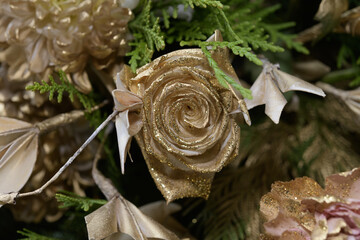 gold and gold glitter tinted or painted roses close-up background