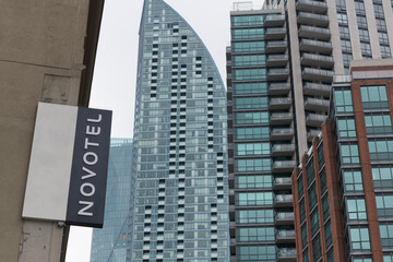 Fototapeta premium projecting sign outside Novotel Toronto Centre, four-star hotel, located at 45 The Esplanade