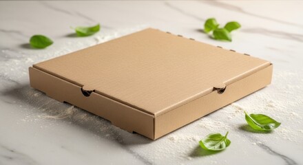 A brown cardboard pizza box sits on a marble countertop surrounded by scattered green leaves and flour.